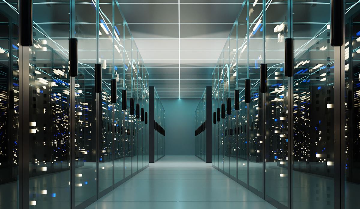 A spacious data center hallway filled with rows of servers