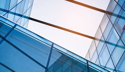 Contemporary glass structure with a clear sky backdrop