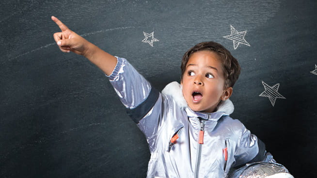 Child in space suit pointing their finger