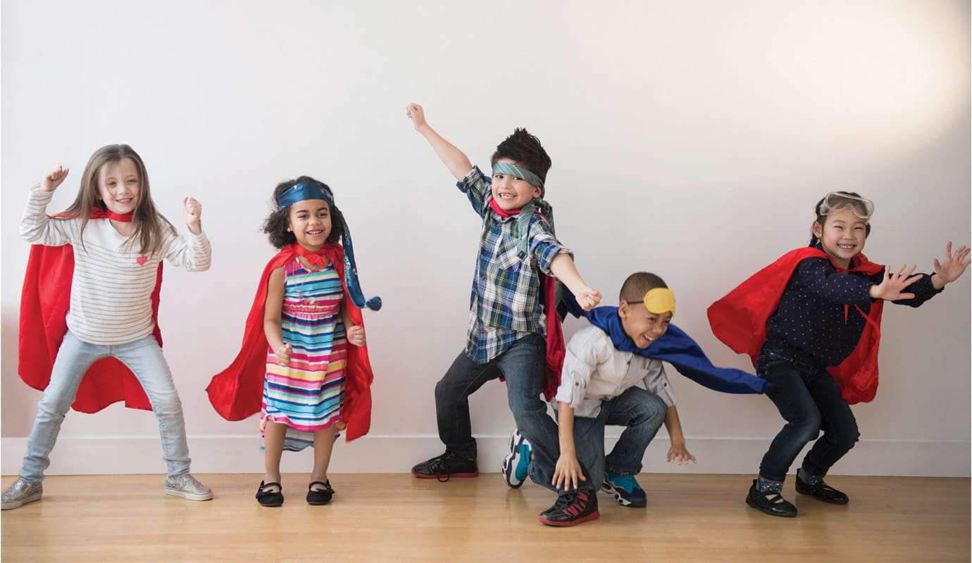 Group of children in superhero cape