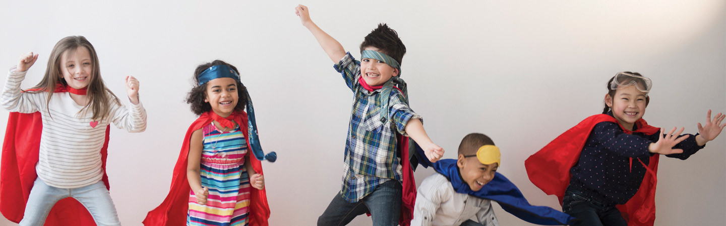 Group of children in superhero cape