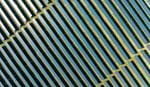 Aerial view of neatly arranged rows of solar panels installed on open land