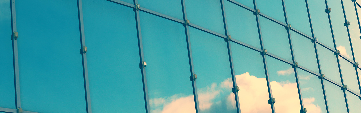 Glass window with reflection of sky