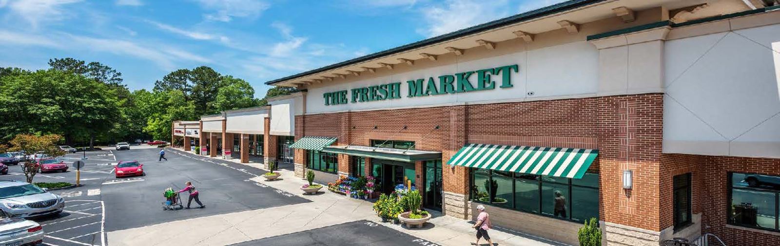 A wider view of a The Fresh Market grocery store