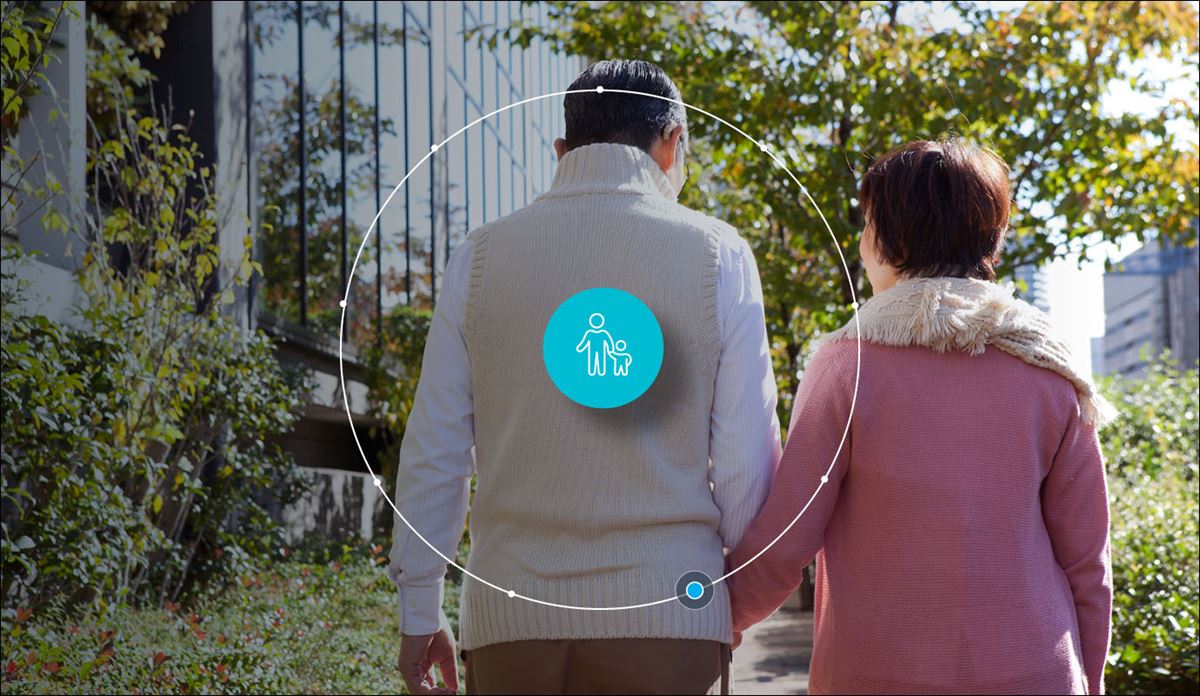 Two older adults walking