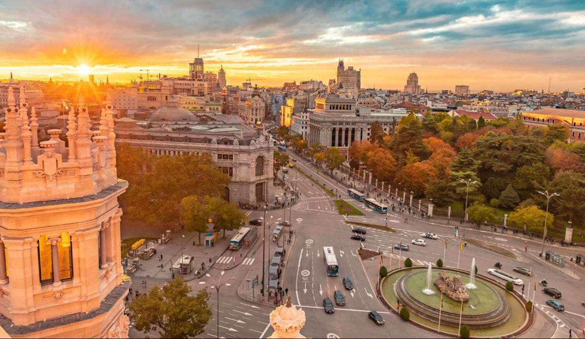 Aerial view of city intersection with sunset lightening
