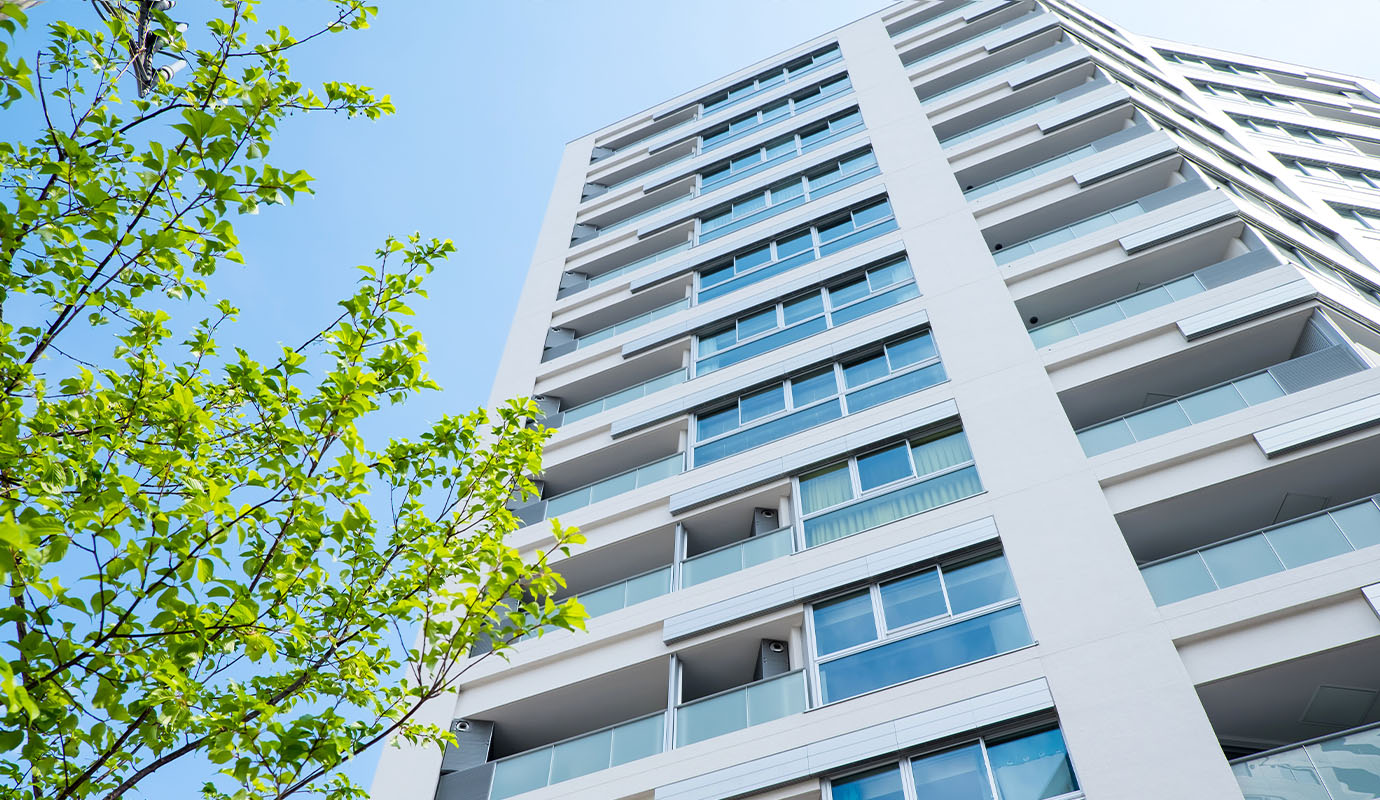 Looking up at a tall residential building